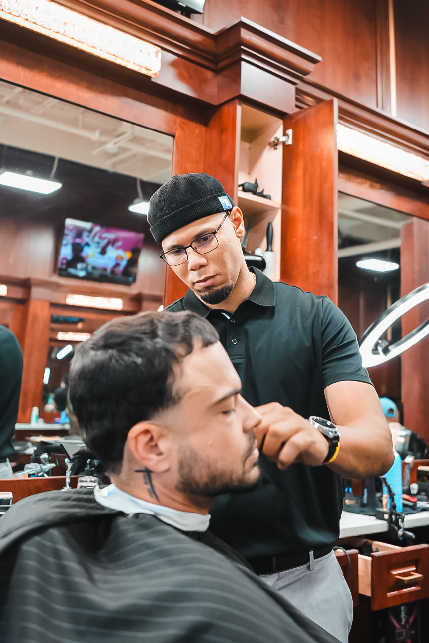 Famous Fadez barber detailing a client’s beard