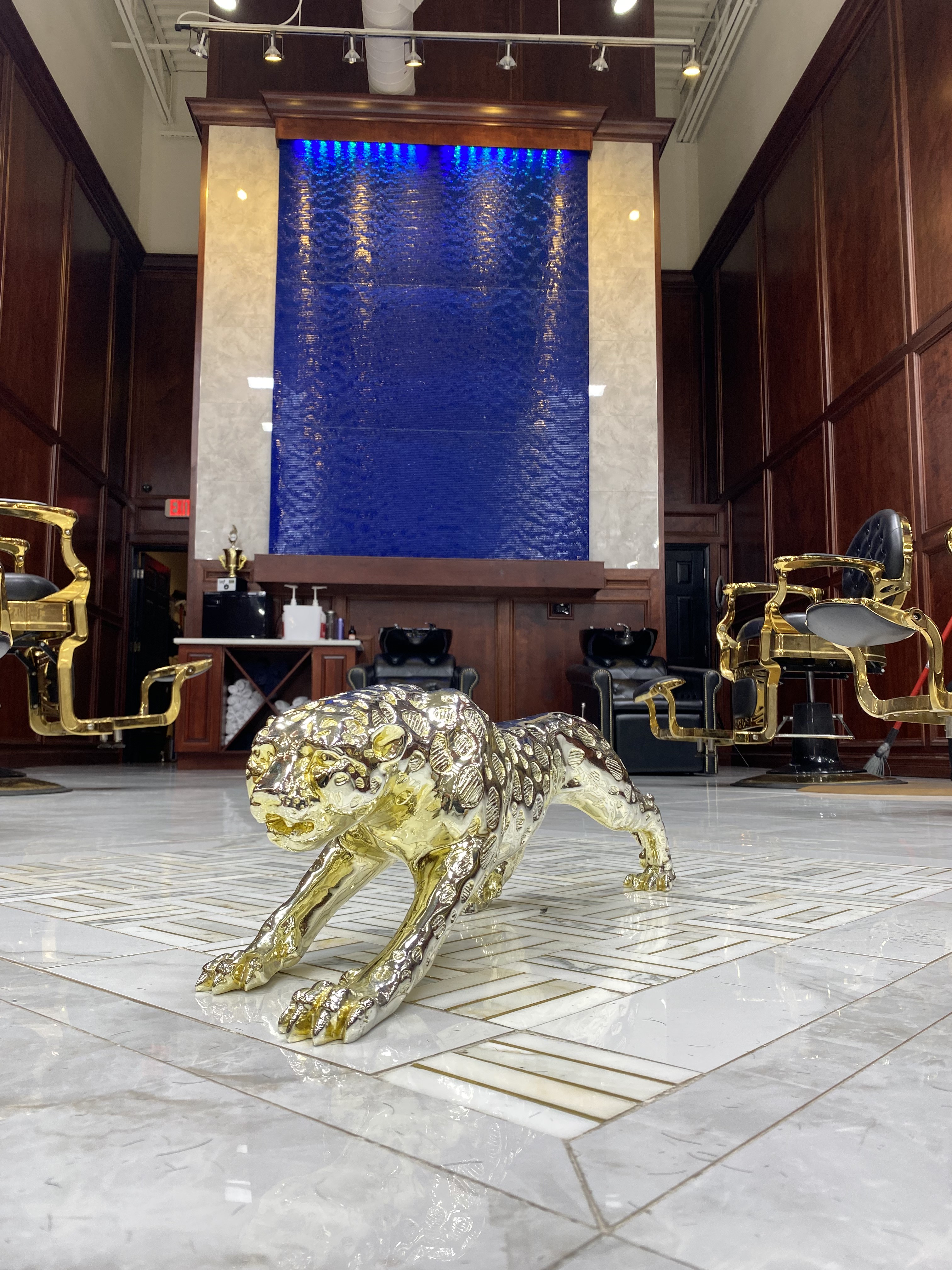 Gold panther sculpture inside Famous Fadez